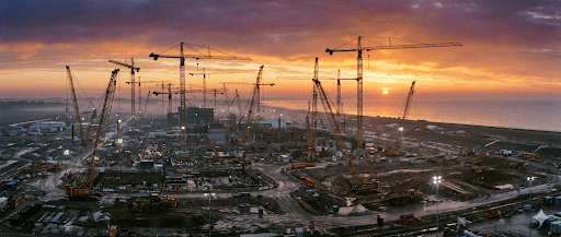 Sizewell C construction site featuring multiple tower cranes and heavy lifting operations in Suffolk.